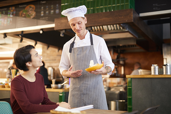 Chef interacting with guest